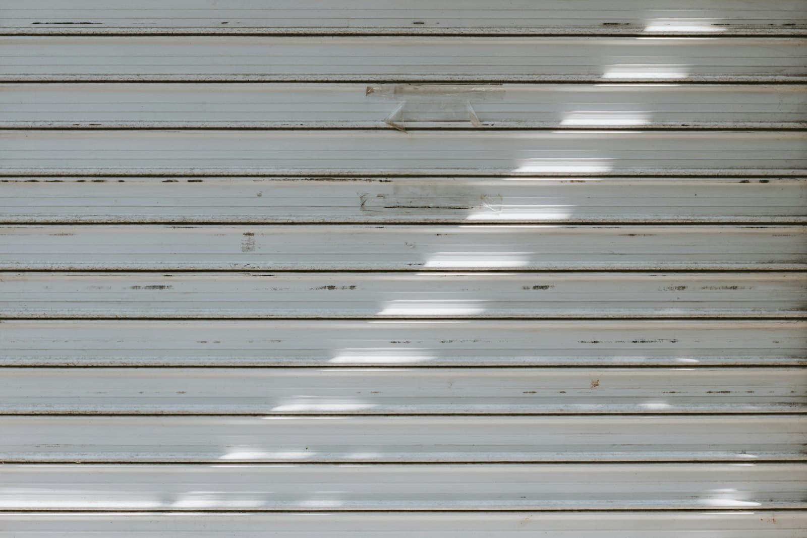 A closed metallic-finish rolling shutter with horizontal slats
